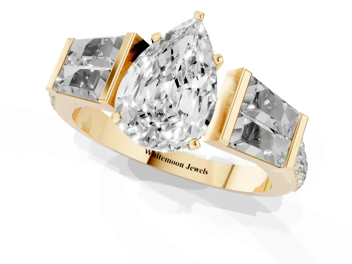 Pear Cut Diamond Engagement Ring with Baguette Side Stones and Channel Set Band Yellow gold