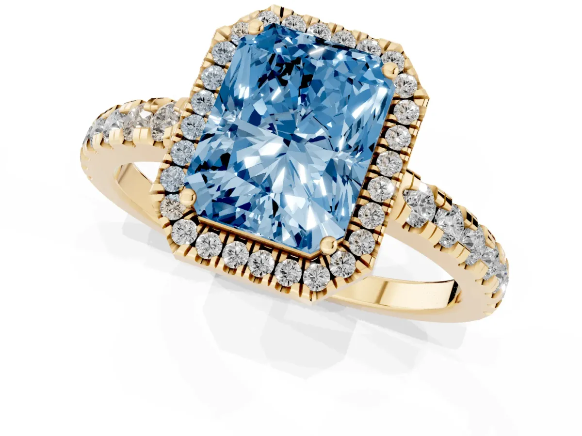 Fancy Blue Radiant Cut Diamond Halo Ring with Pavé Band and Four-Prong Setting Yellow gold