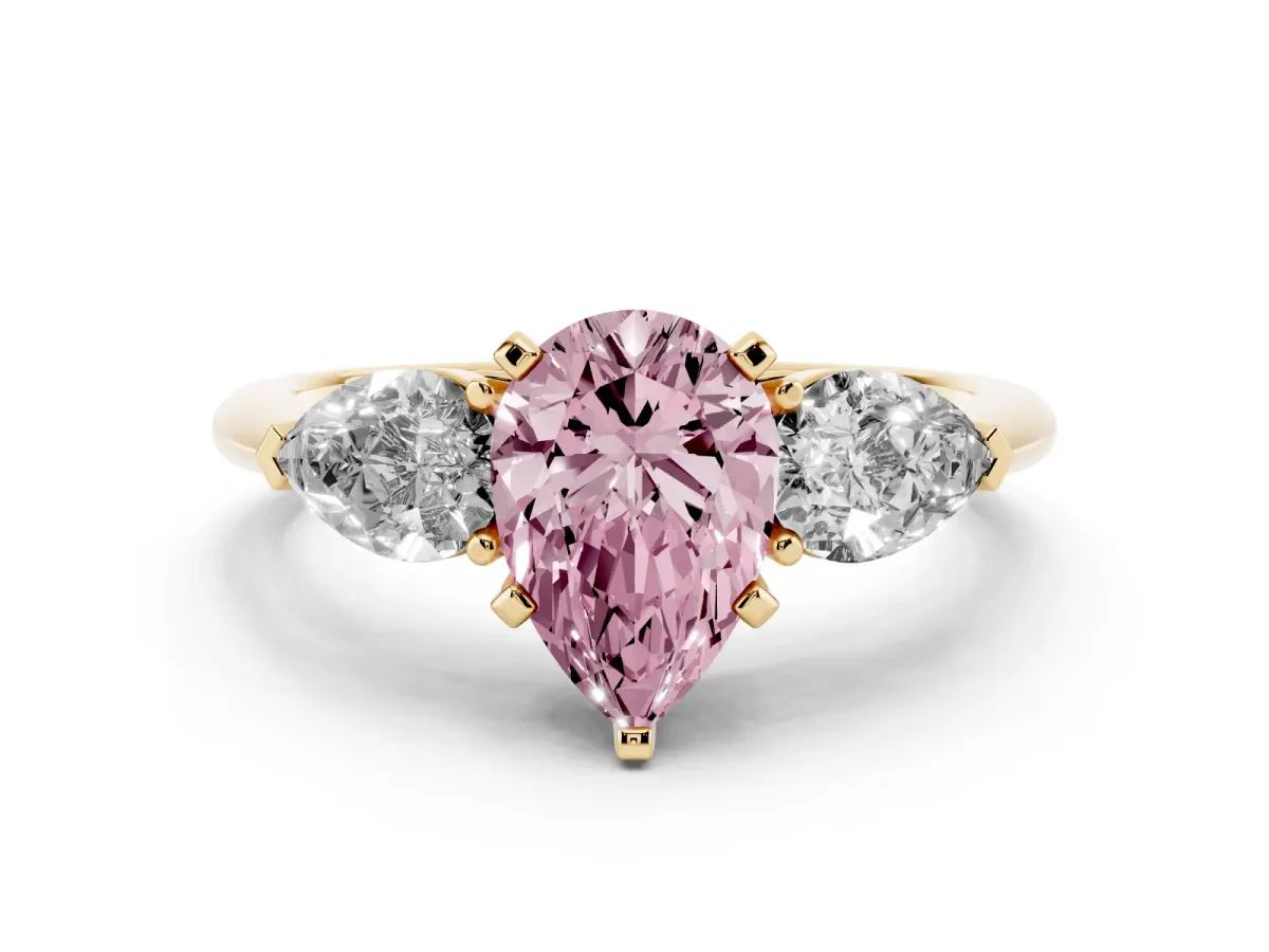Fancy Pink Three-Stone Pear Cut Diamond Ring with Pear Side Stones and Four-Prong Setting Yellow gold