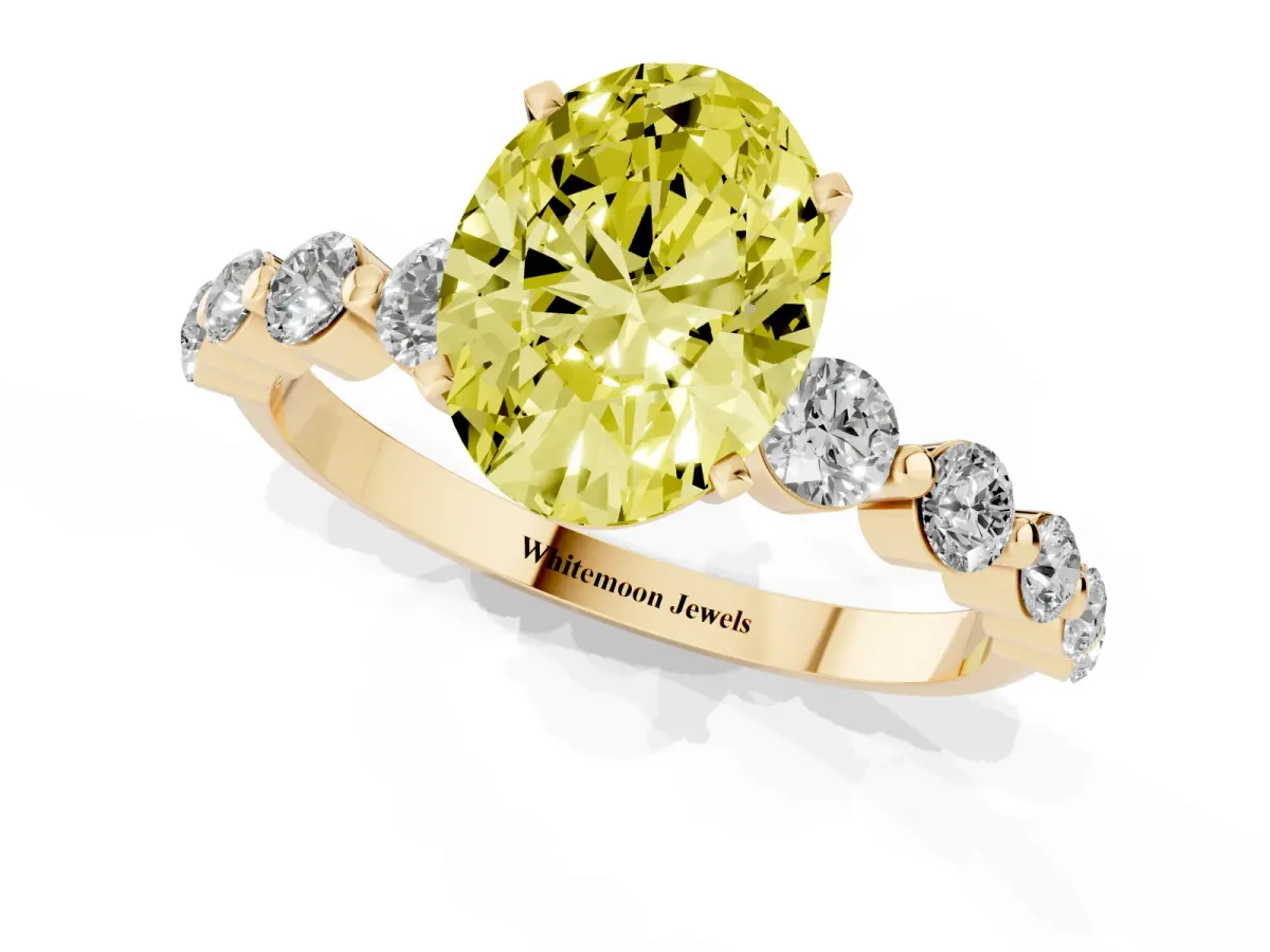 Fancy Yellow Oval Cut Solitaire Diamond Ring with Pave Band and Four-Prong Setting Yellow gold