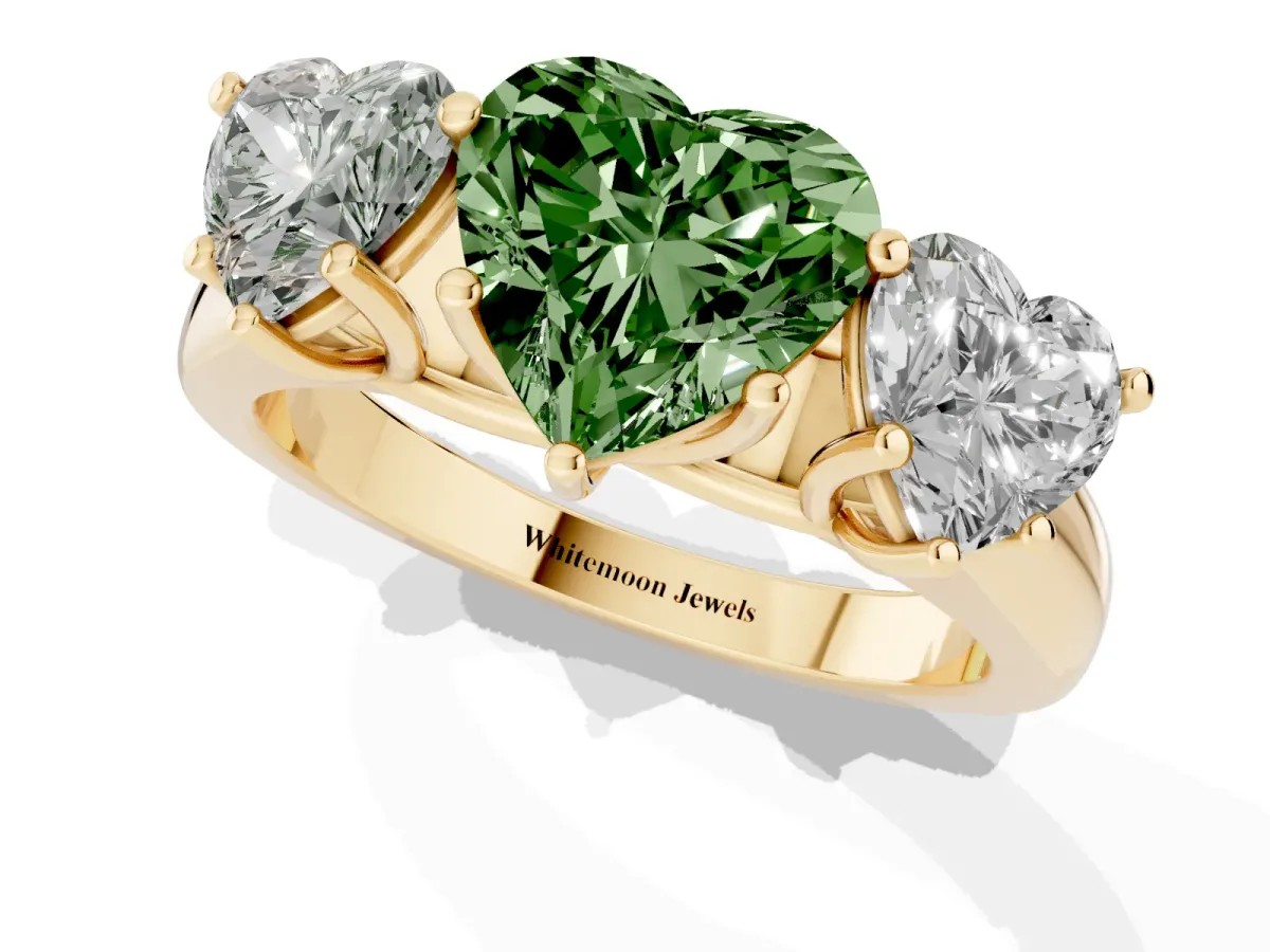 Fancy Green Heart Cut Three-Stone Diamond Ring with Prong Setting on a Classic Band Yellow gold
