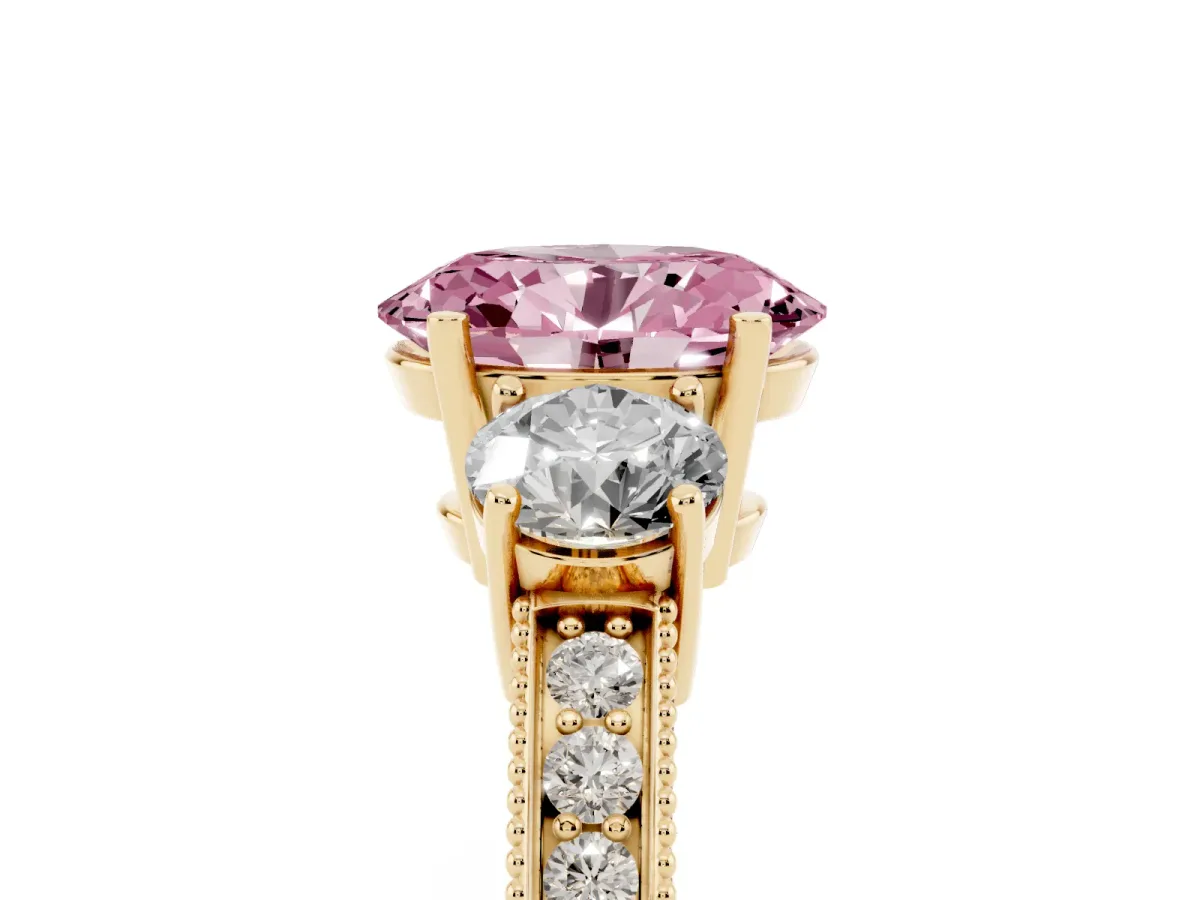 Fancy Pink Oval Cut Three-Stone Diamond Ring with Pavé Band and Four-Prong Setting Yellow gold