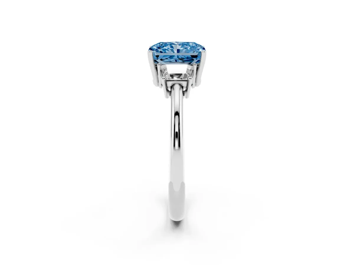 Fancy Blue Radiant Cut Diamond Three-Stone Ring with Trapezoid Side Stones and Prong Setting Silver