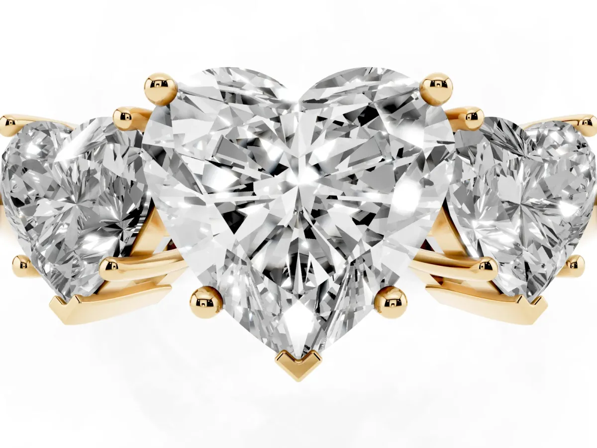 Three-Stone Heart Cut Cut Diamond Engagement Ring with Prong Setting on a White Gold Band Yellow gold