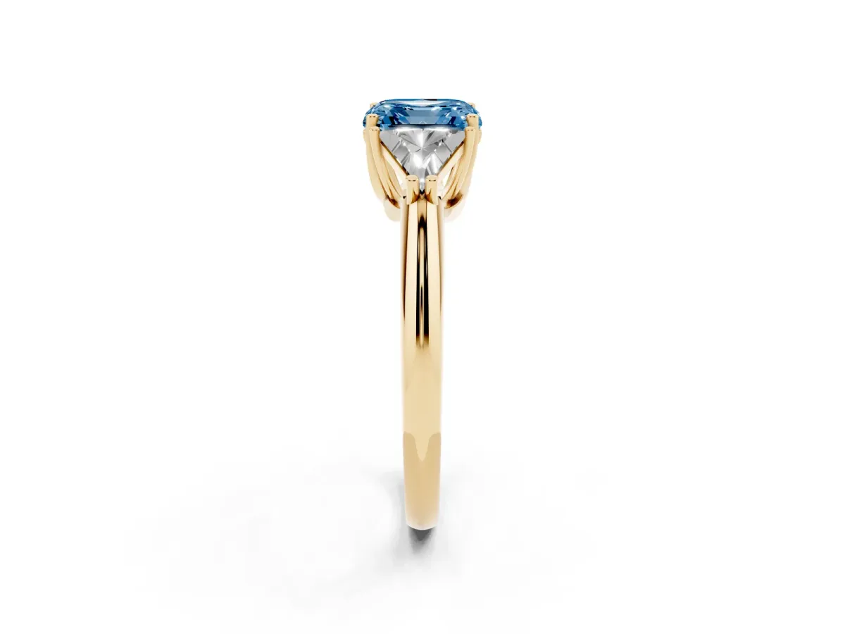 Fancy Blue Three-Stone Asscher Cut Diamond Engagement Ring with Trillion Side Stones and Prong Setting Yellow gold