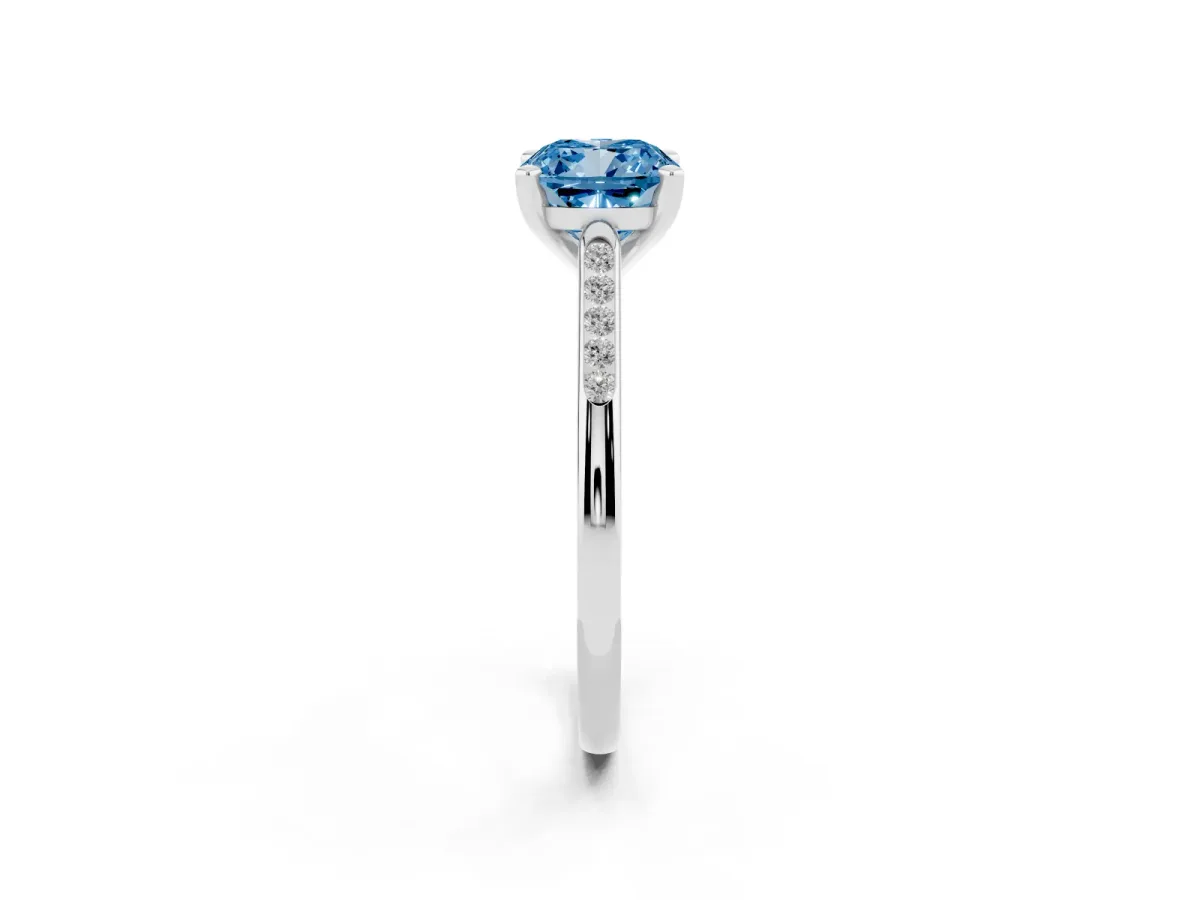 Fancy Blue Cushion Cut Diamond Solitaire Ring with Channel Set Round Band and Prong Setting Silver