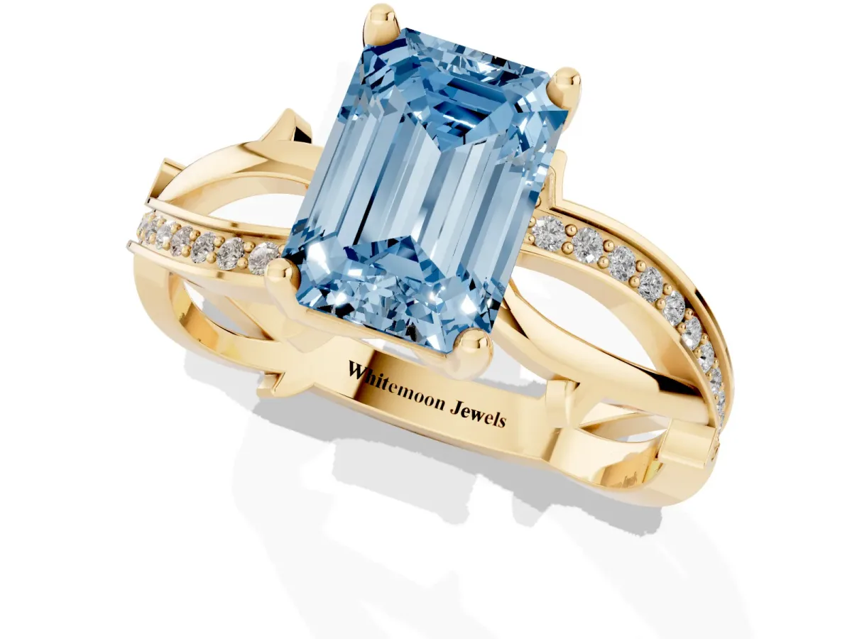 Fancy Blue Emerald Cut Solitaire Twist Band with Pavé Accents and Four-Prong Setting Yellow gold
