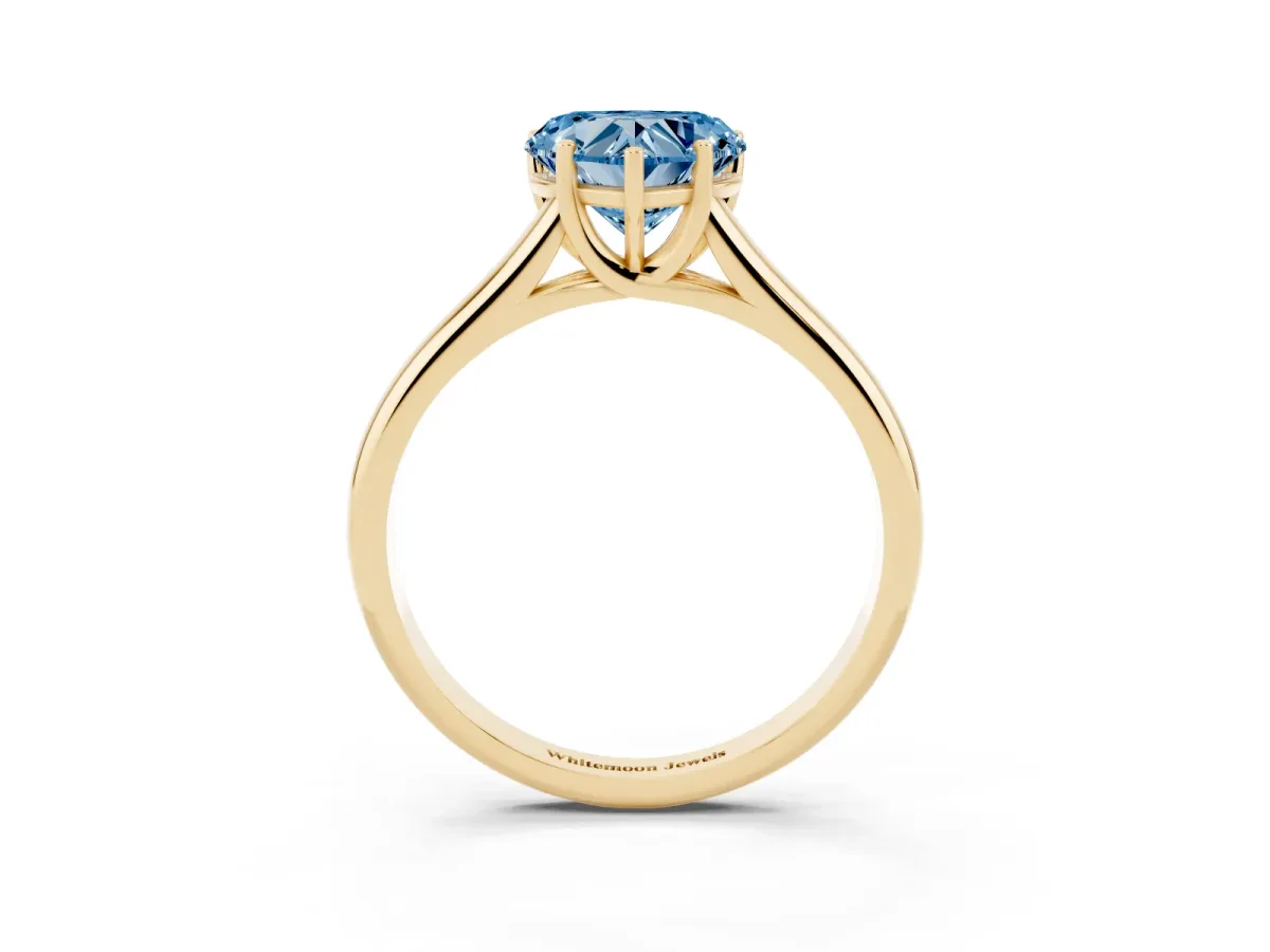 Fancy Blue Heart Cut Cut Diamond Solitaire Engagement Ring with Tapered Plain Band and Four-Prong Setting Yellow gold