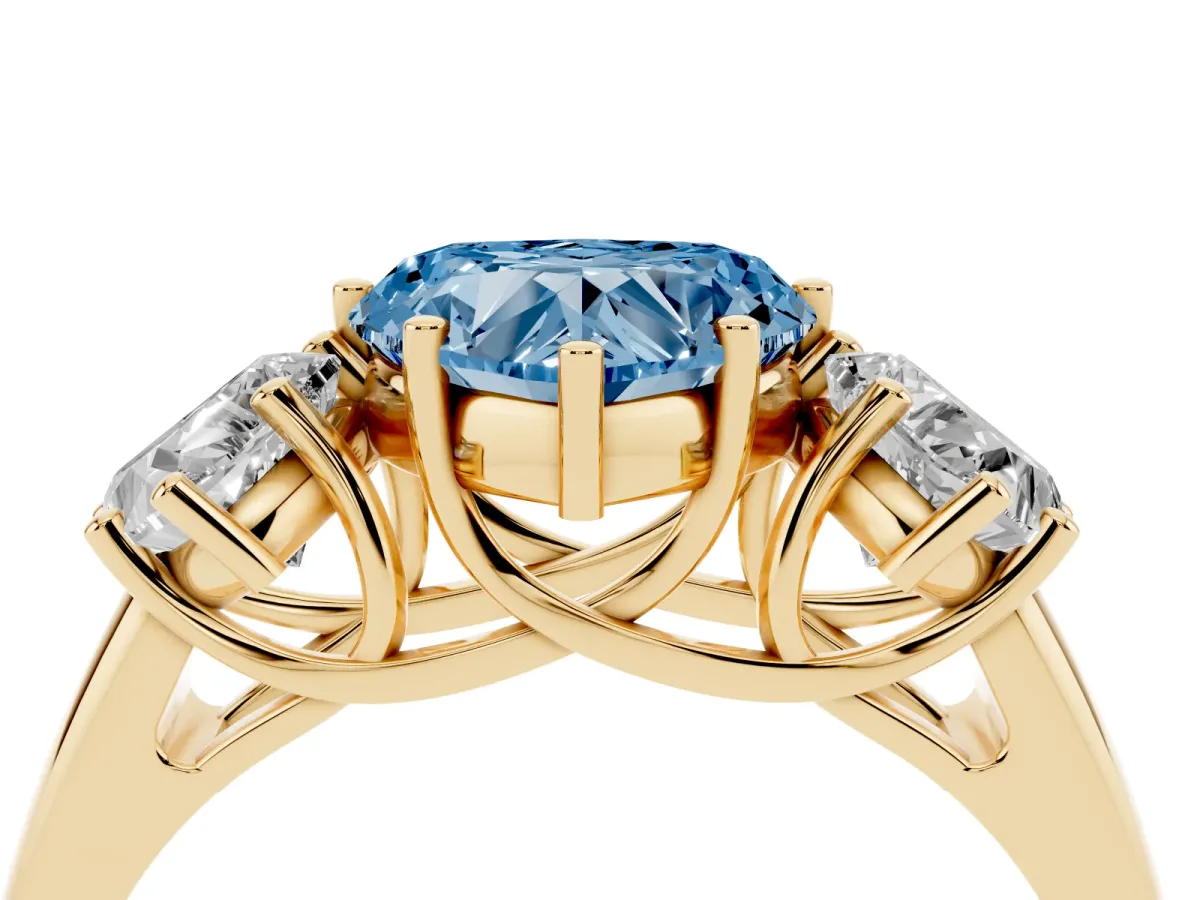 Fancy Blue Three-Stone Heart Cut Diamond Engagement Ring with Prong Setting Yellow gold
