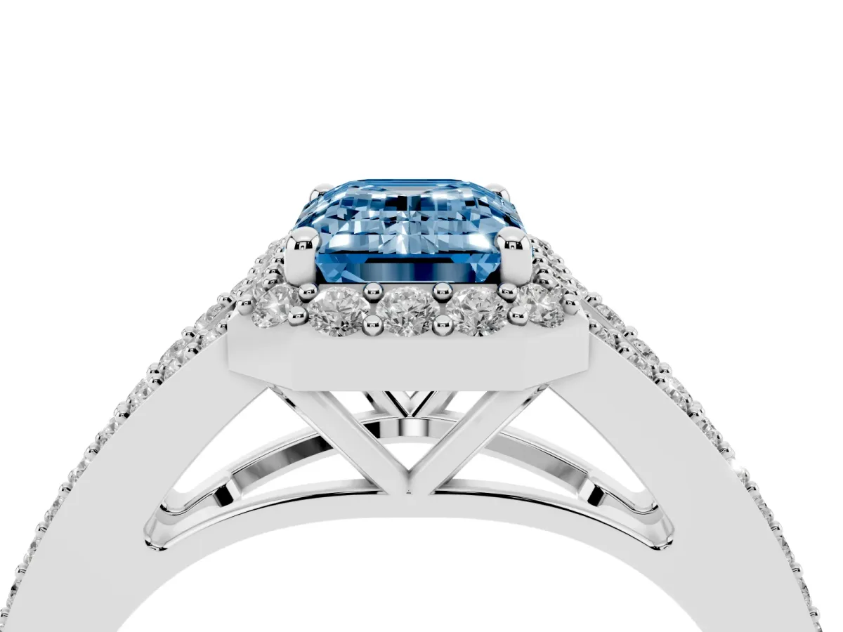 Fancy Blue Emerald Cut Halo Split Shank Pave Diamond Ring with Four-Prong Setting Silver