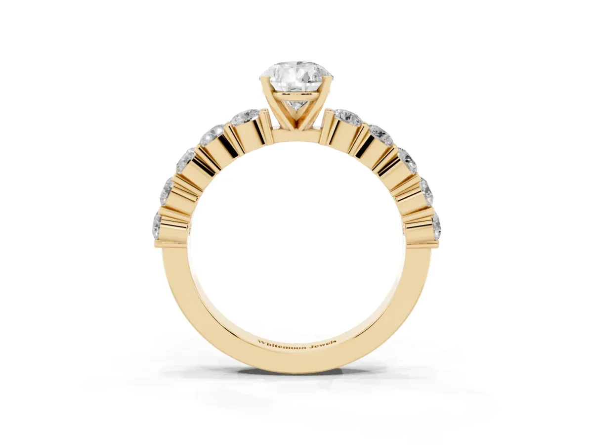 Pear Cut Diamond Solitaire Ring with Shared Prong Round Side Stones Yellow gold