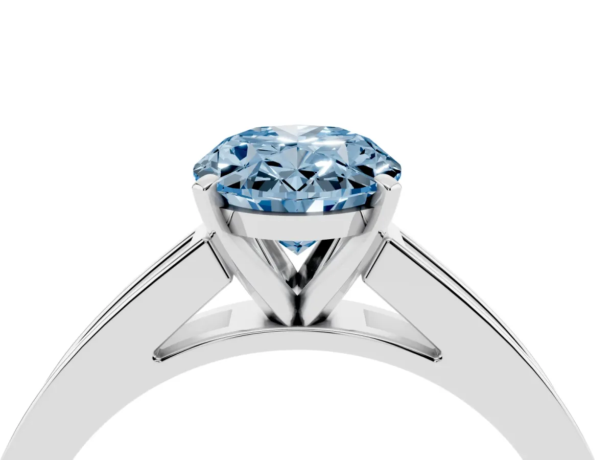 Fancy Blue Oval Cut Solitaire Diamond Ring with Channel-Set Band and Four-Prong Setting Silver