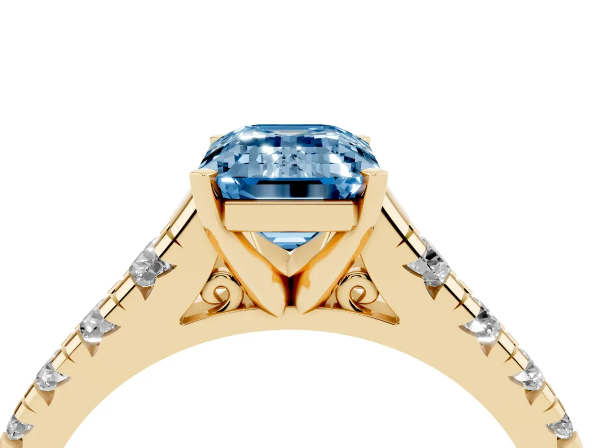 Fancy Blue Emerald Cut Diamond Cathedral Solitaire Ring with Round Pavé Band Yellow gold