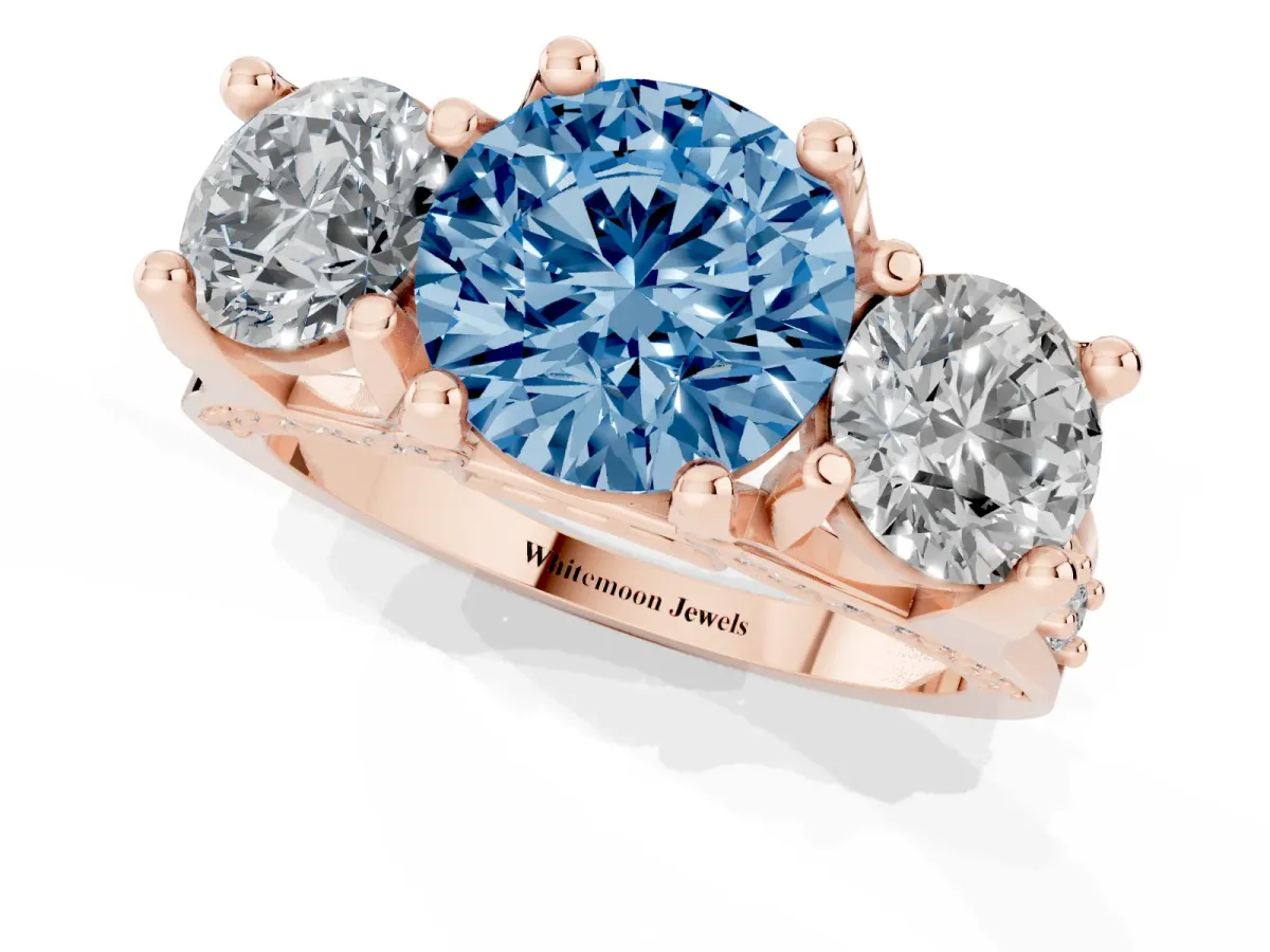 Fancy Blue Round Cut Diamond Three-Stone Ring with Channel Set Band and Four-Prong Setting Rose gold