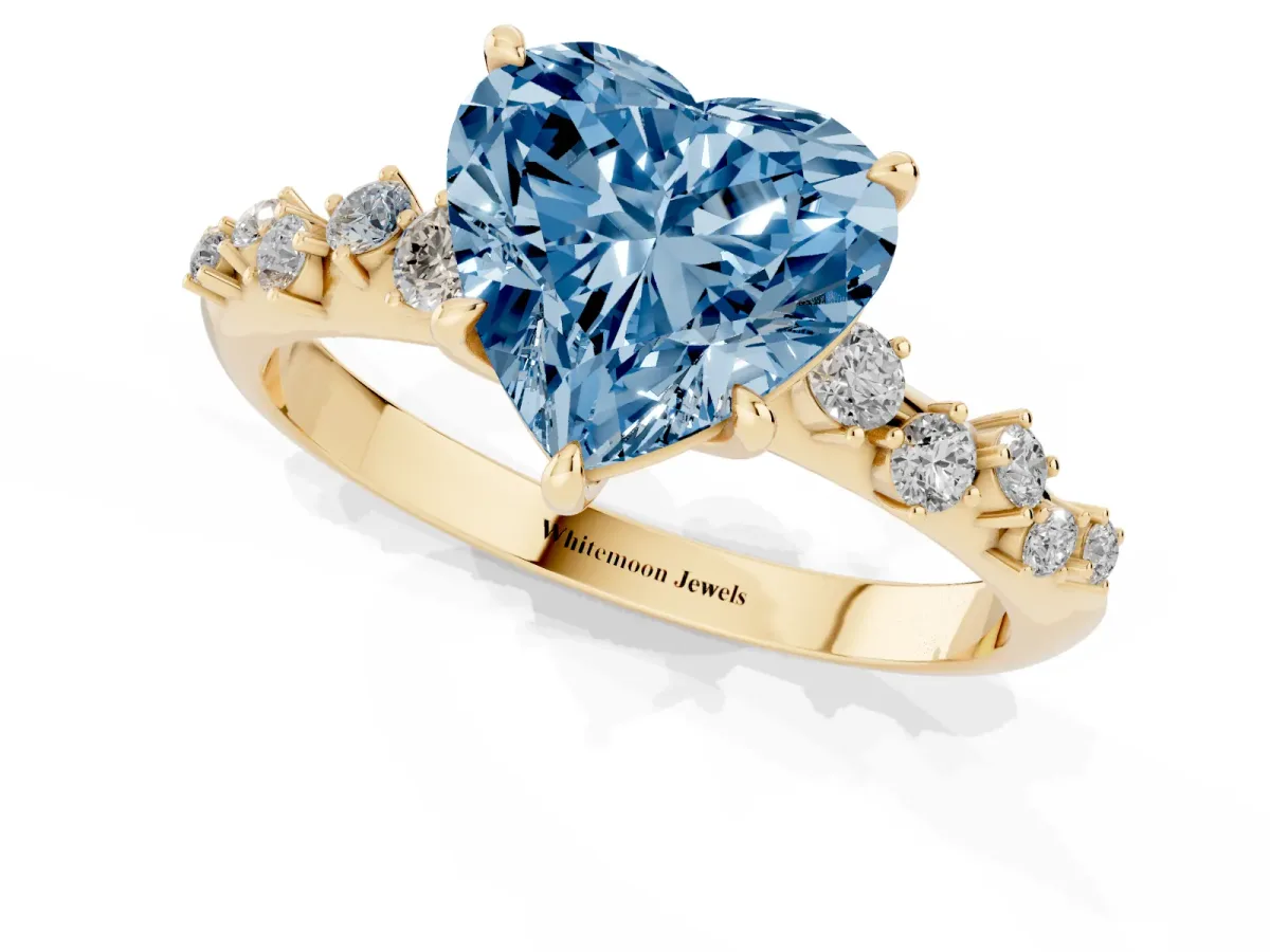 Fancy Blue Heart Cut Diamond Cluster Side Stone Solitaire Ring with Prong Setting Yellow gold