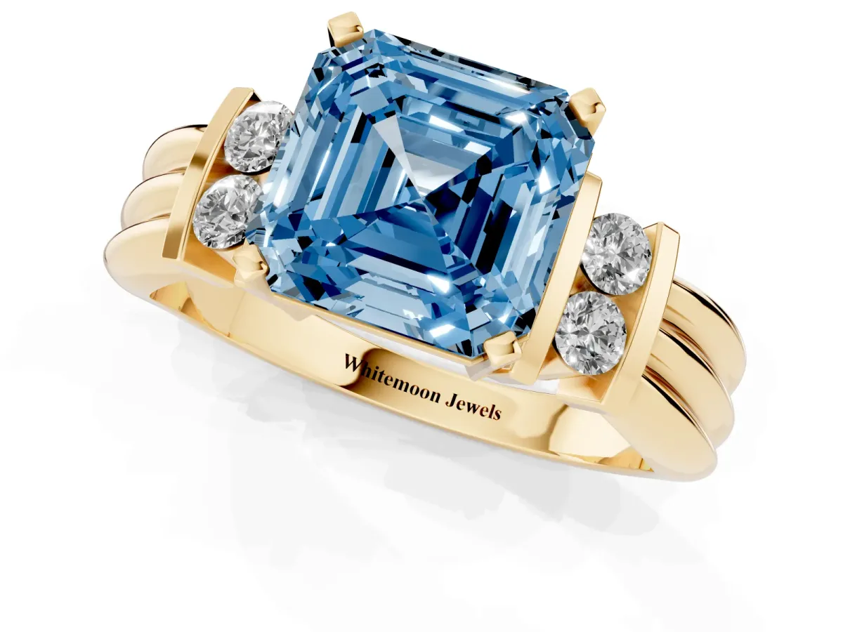 Fancy Blue Asscher Cut Cut Three-Stone Channel Set Ring with Bar Prongs Yellow gold