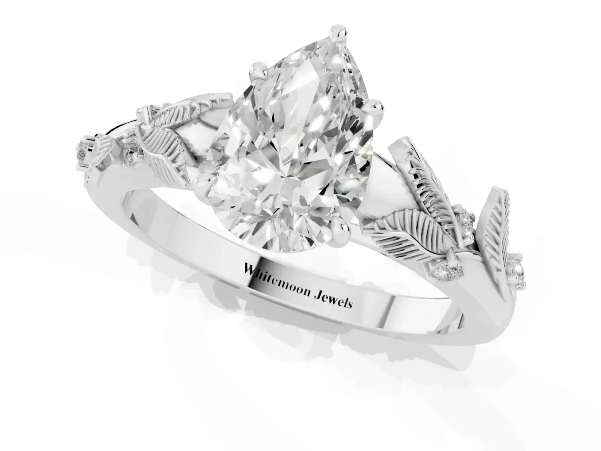 Pear Cut Diamond Solitaire Ring with Leaf Motif Band and Four-Prong Setting Silver