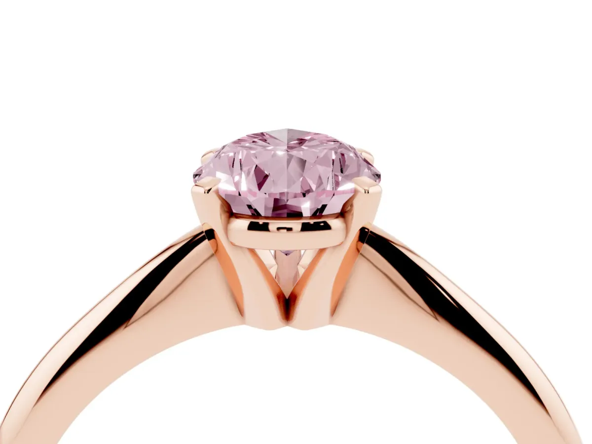 Fancy Pink Pear Cut Cut Solitaire Ring with Four-Prong Setting on a Classic Band Rose gold