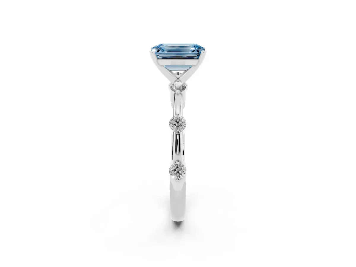 Fancy Blue Emerald Cut Solitaire Diamond Ring with Bezel Set Side Stones and Prong Setting Silver