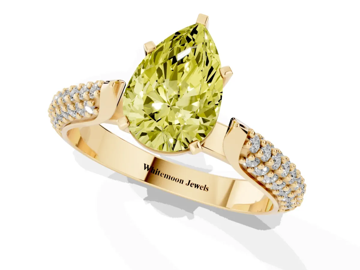 Fancy Yellow Pear Cut Diamond Solitaire Engagement Ring with Multi-Row Round Pavé Band and Prong Setting Yellow gold