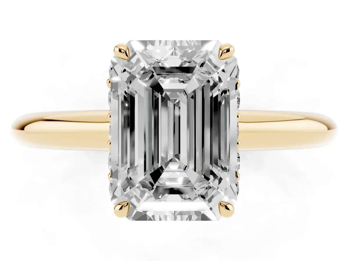 Emerald Cut Brilliant Solitaire Engagement Ring with Six-Prong Setting and Classic Band Yellow gold