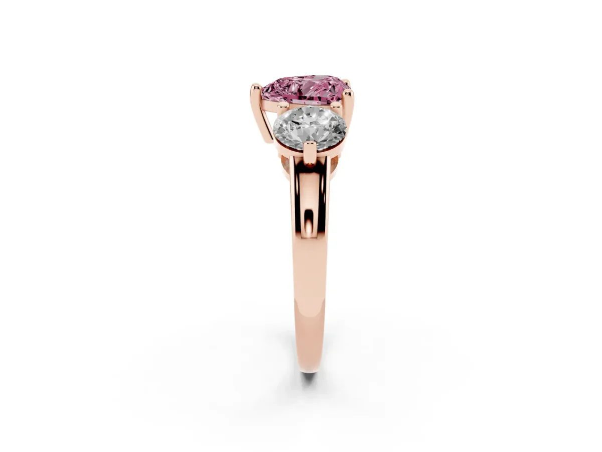 Fancy Pink Three-Stone Heart Cut Brilliant Cut Solitaire Ring with Prong Setting on a Classic Band Rose gold
