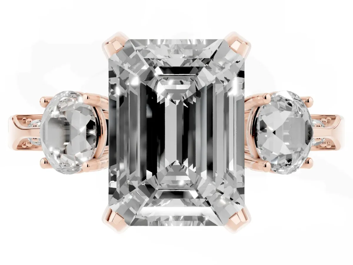 Fancy Pink Emerald Cut Brilliant Three-Stone Diamond Ring with Pavé Band and Four-Prong Setting Rose gold
