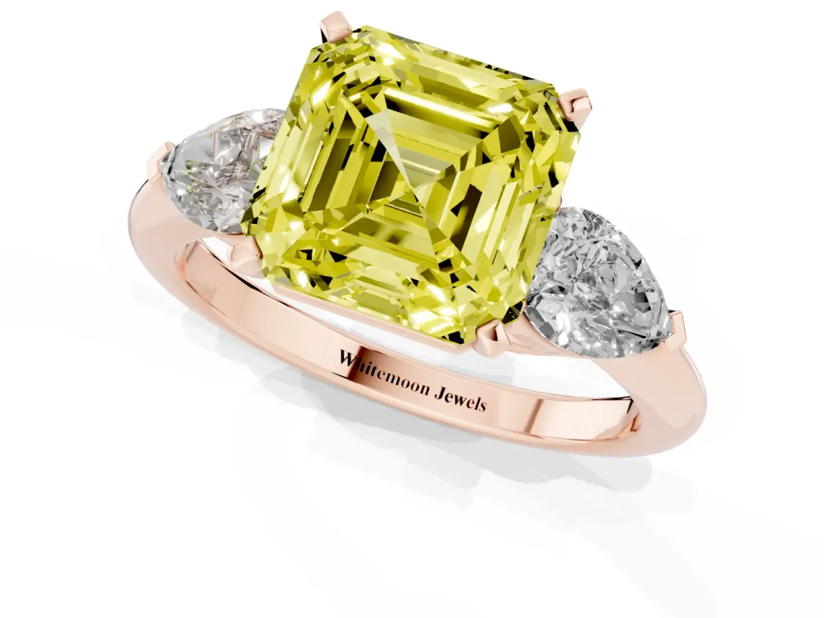 Fancy Yellow Three-Stone Asscher Cut Diamond Ring with Pear Side Stones and Four-Prong Setting Rose gold