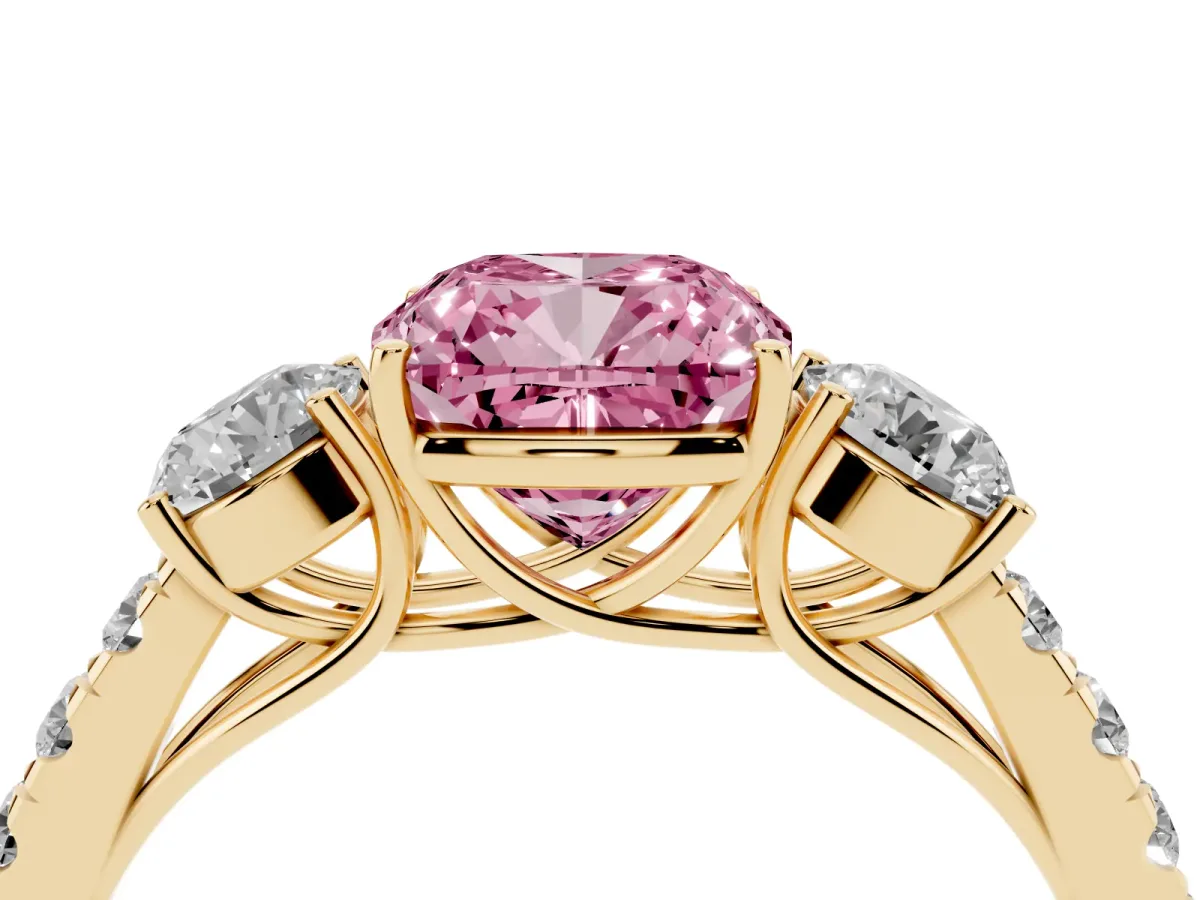 Fancy Pink Cushion Cut Cut Diamond Three-Stone Ring with Round Side Stones and Pavé Band Yellow gold