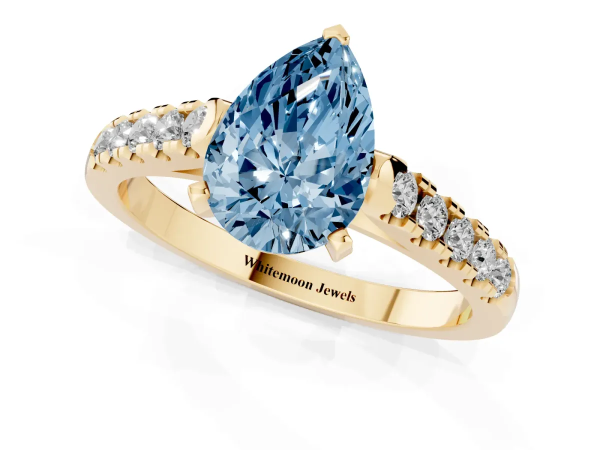 Fancy Blue Pear Cut Diamond Pavé Band Solitaire Ring with Prong Setting Yellow gold