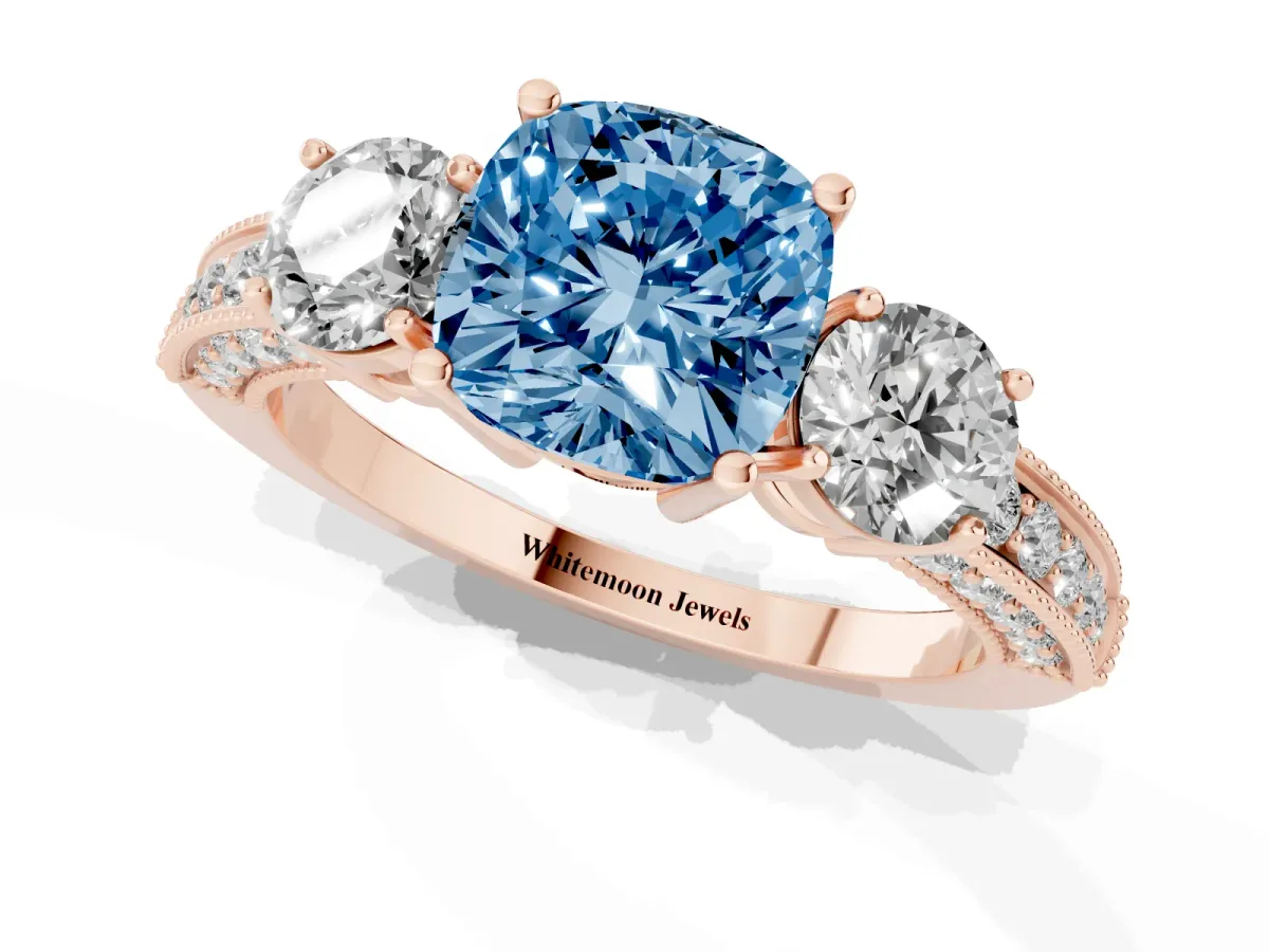 Fancy Blue Cushion Cut Three-Stone Diamond Ring with Pavé Band and Four-Prong Setting Rose gold