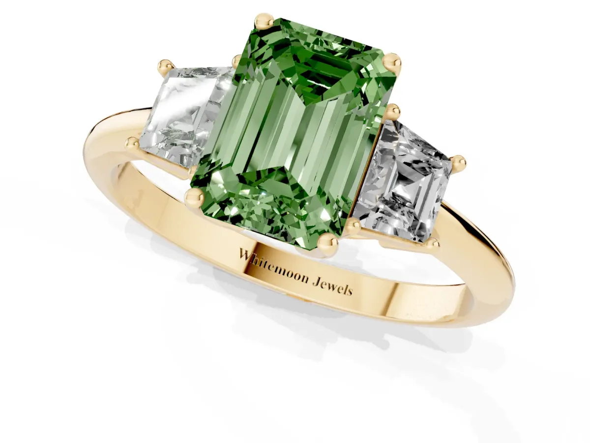 Fancy Green Emerald Cut Diamond Three-Stone Ring with Trapezoid Side Stones and Prong Setting Yellow gold