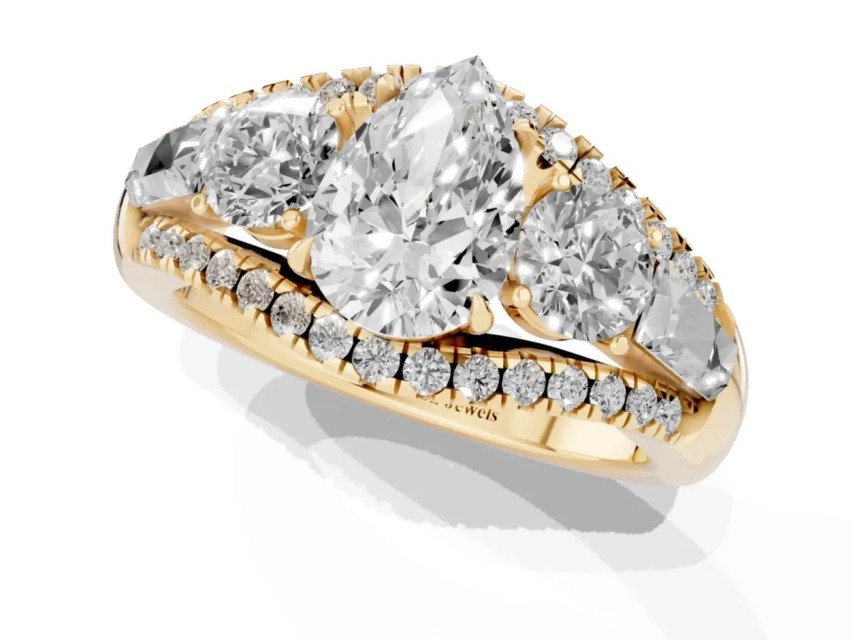 Three-Stone Pear Cut Diamond Engagement Ring with Pave Band and Prong Setting Yellow gold