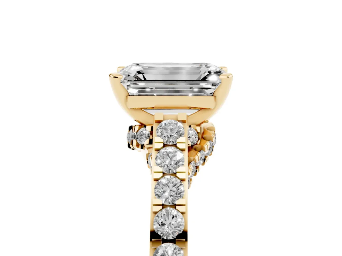 Emerald Cut Diamond Solitaire Ring with Crossover Gallery and Round Pavé Band Yellow gold