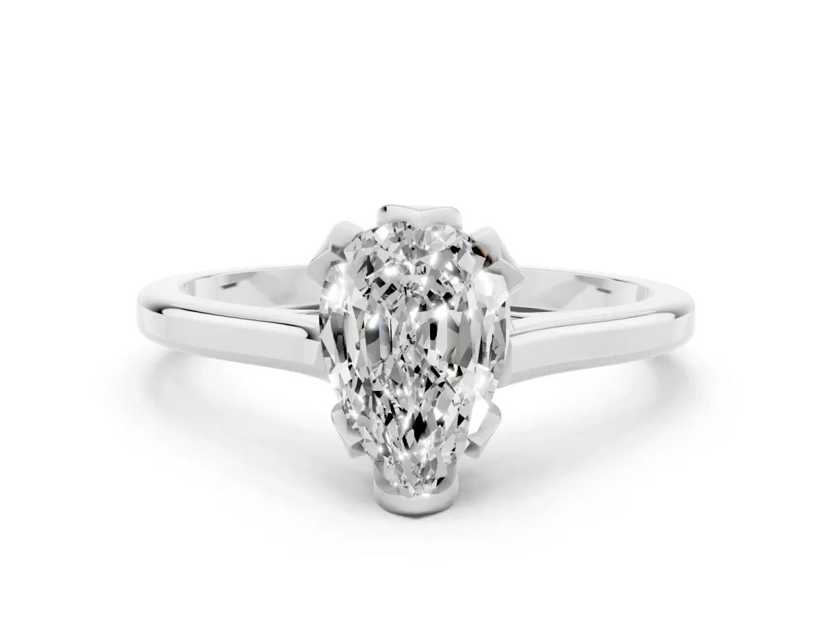 Pear Cut Diamond Solitaire Ring with Flower Prong Setting and Classic Band Silver