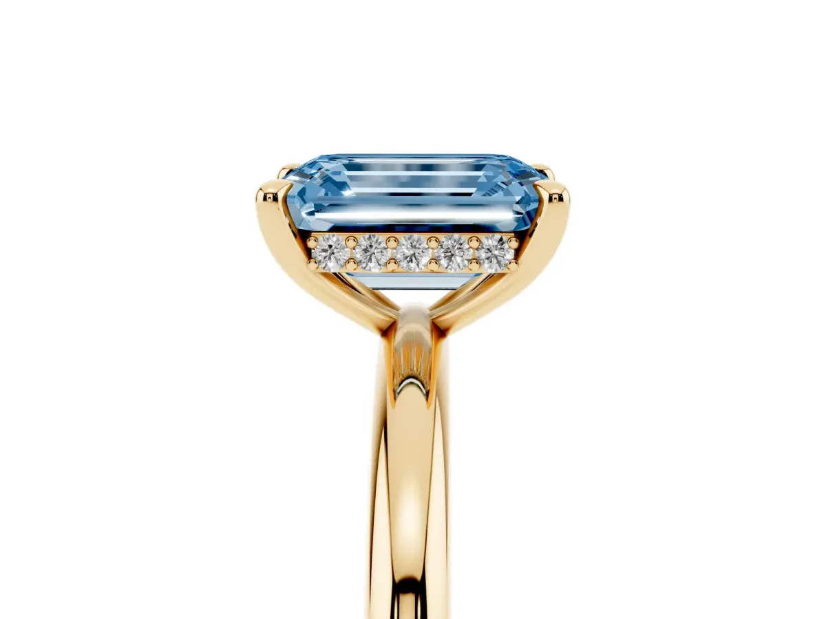 Fancy Blue Emerald Cut Diamond Solitaire Ring with Thin Band and Four-Prong Setting Yellow gold