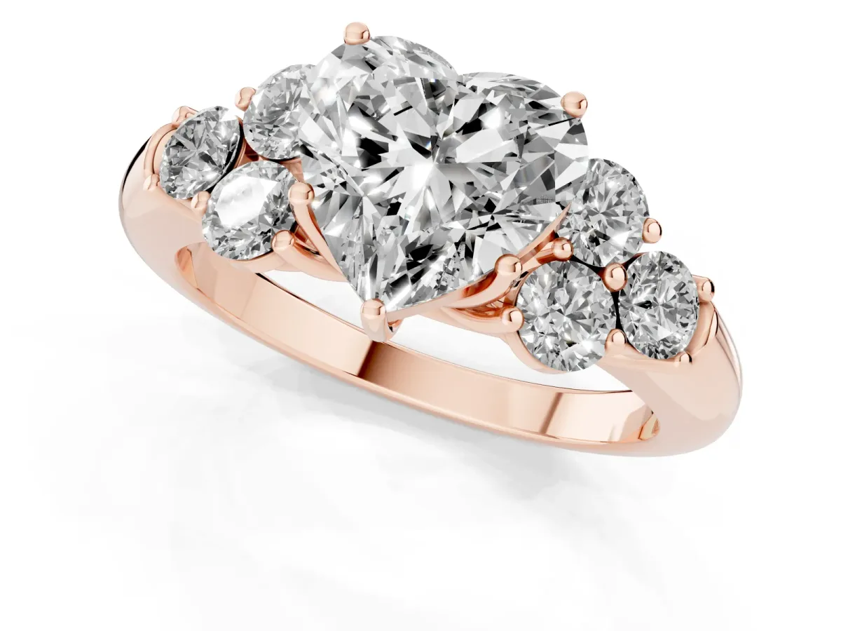 Heart Cut Cut Diamond Cluster Ring with Round Accent Stones and Prong Setting on a Classic Band Rose gold