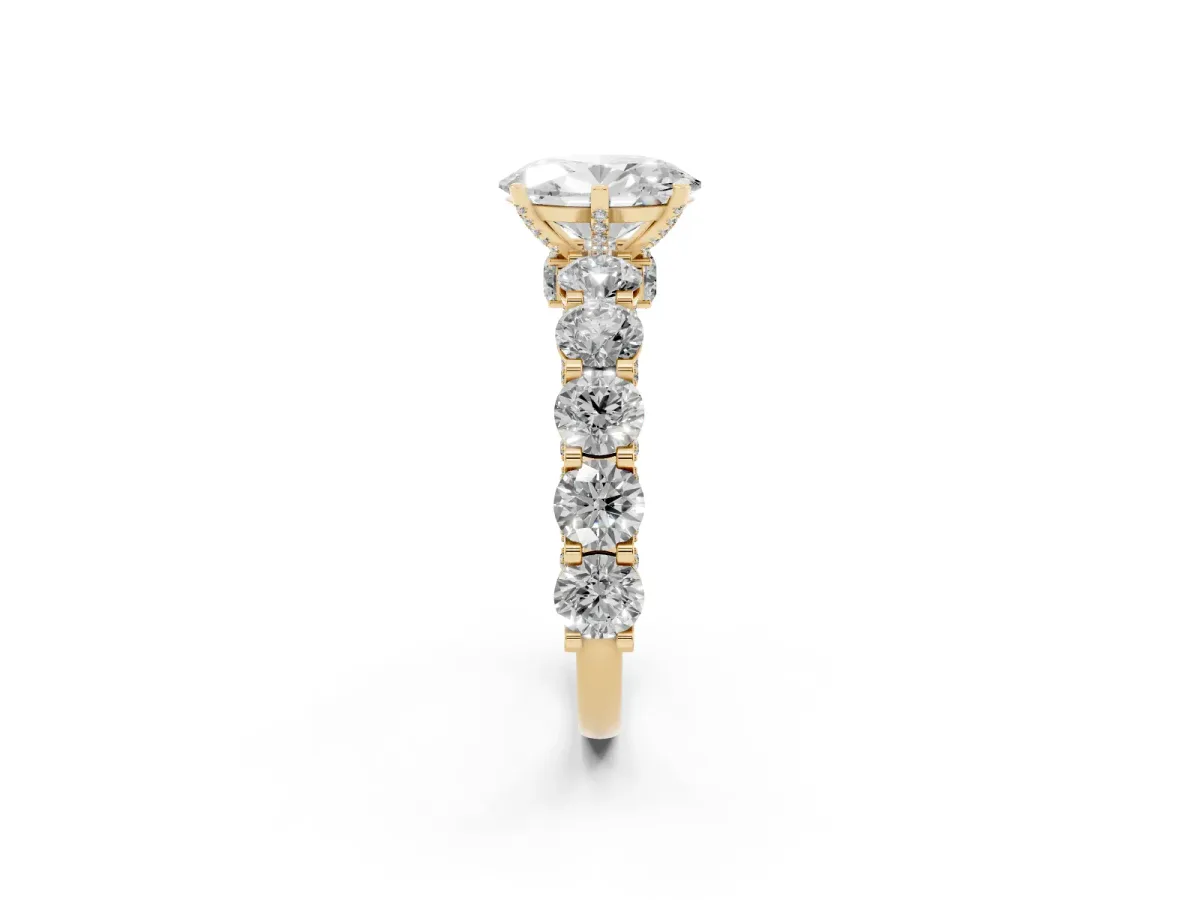 Oval Cut Diamond Side Stone Engagement Ring with Four-Prong Setting Yellow gold