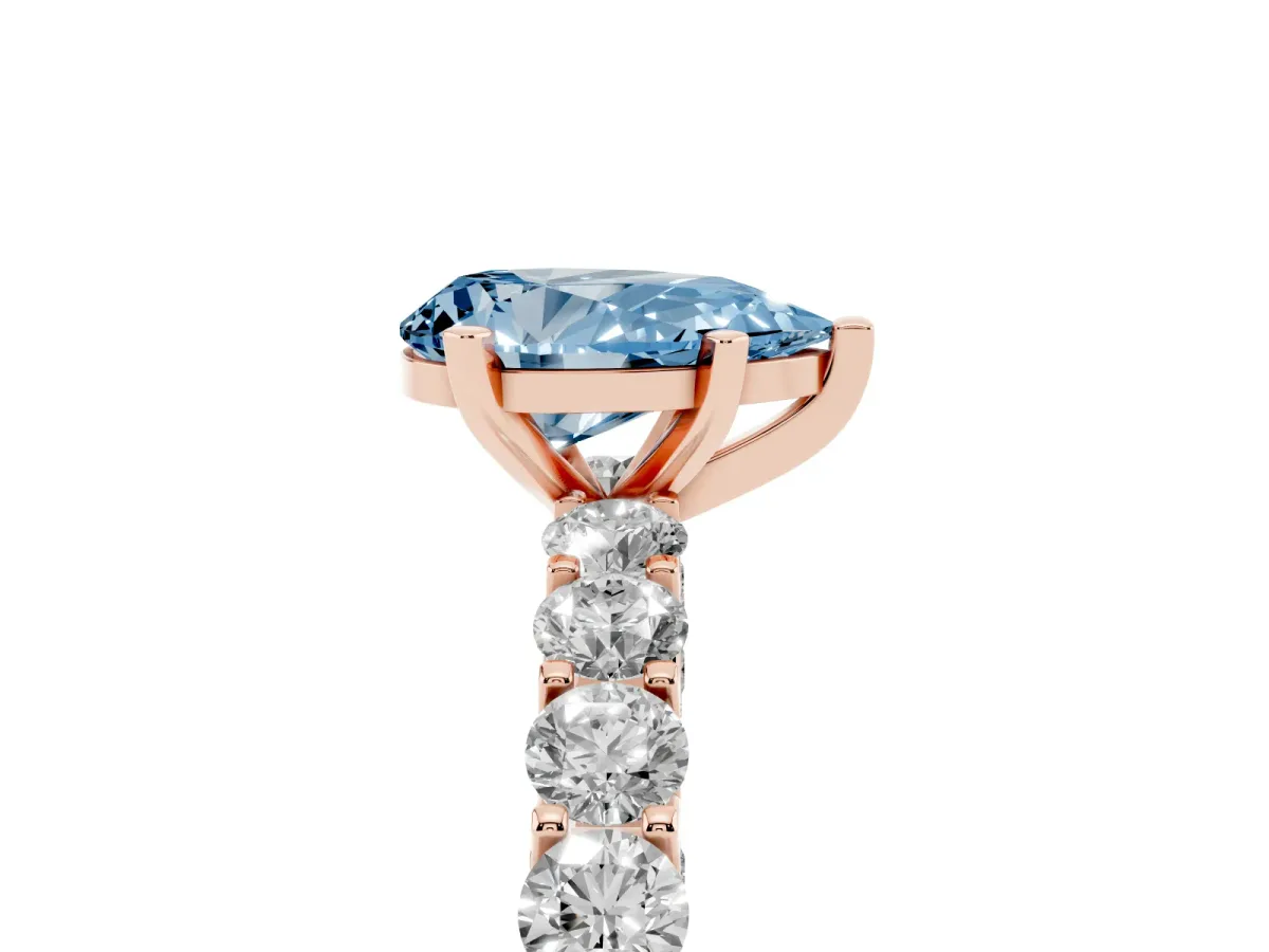 Fancy Blue Pear Cut Diamond Solitaire Ring with Shared Prong Pavé Band and Four-Prong Setting Rose gold