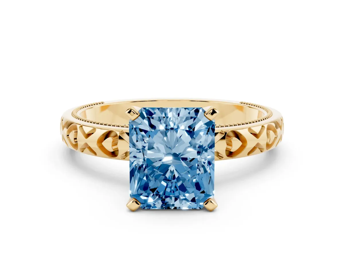 Fancy Blue Radiant Cut Solitaire Diamond Engagement Ring with XO Engraved Band and Four-Prong Setting Yellow gold