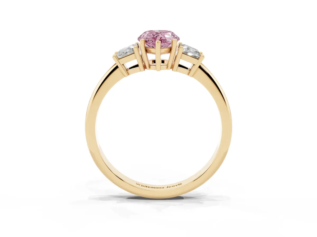 Fancy Pink Pear Cut Diamond Three-Stone Ring with Trapezoid Side Stones and Prong Setting Yellow gold