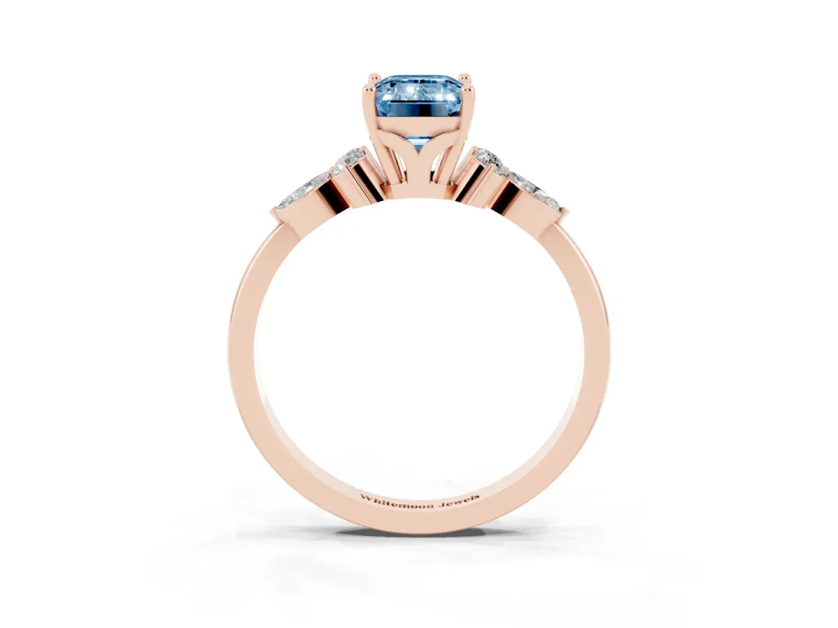 Fancy Blue Emerald Cut Brilliant Diamond Solitaire Ring with Pear Side Stones and Four-Prong Setting Rose gold