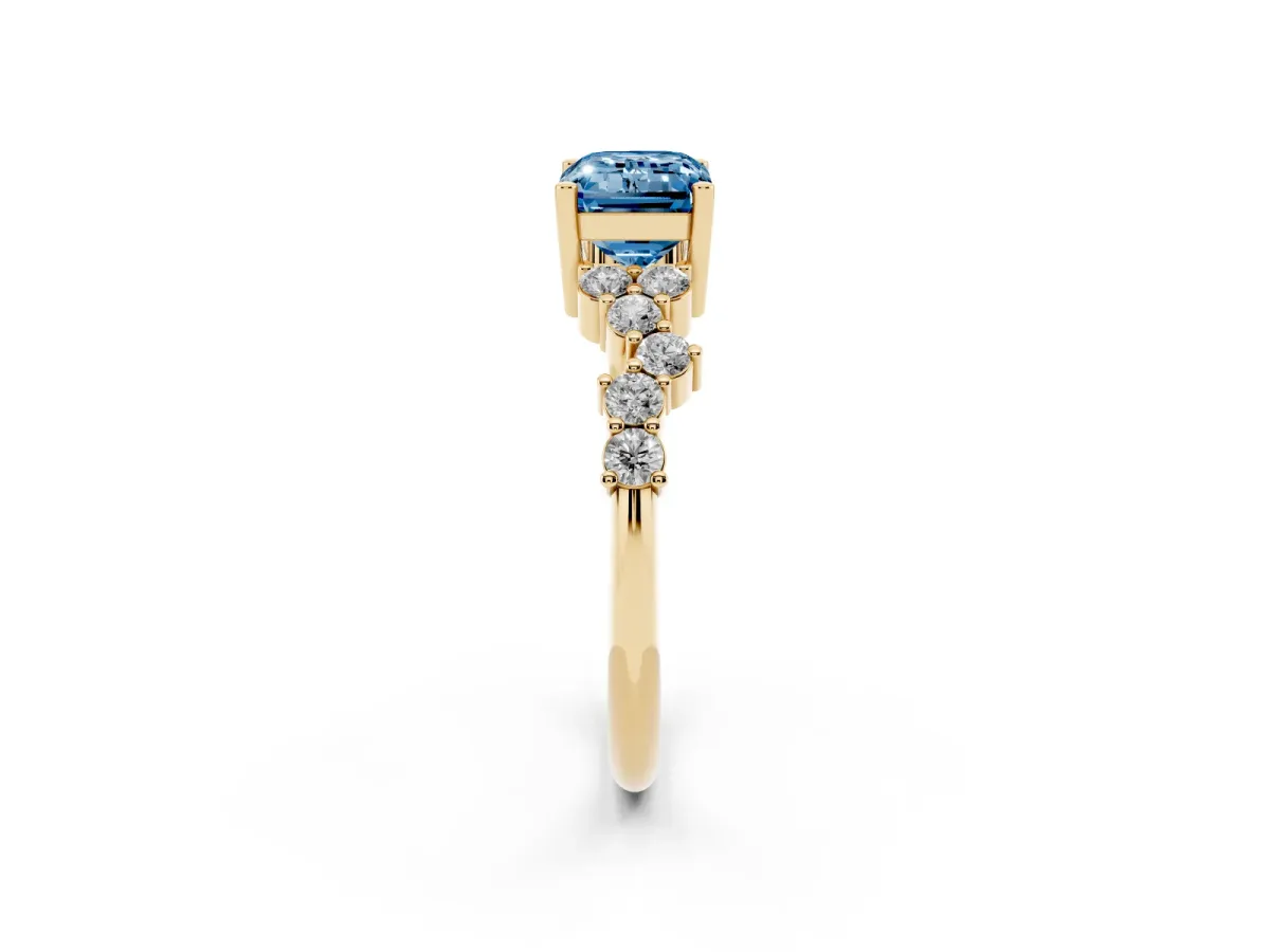 Fancy Blue Emerald Cut Diamond Scattered Round Accent Ring with Prong Setting Yellow gold