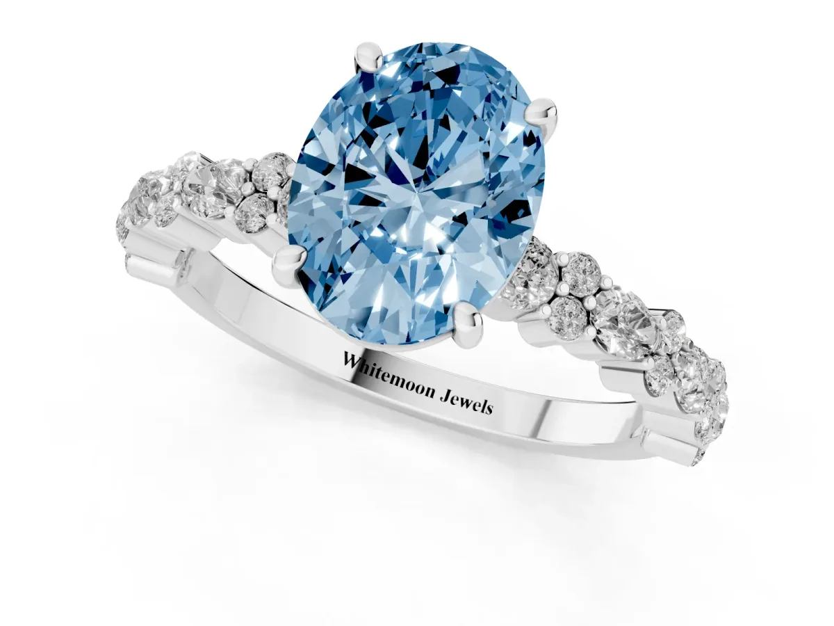 Fancy Blue Oval Cut Diamond Side Stone Solitaire Ring with Round and Four-Prong Setting Silver