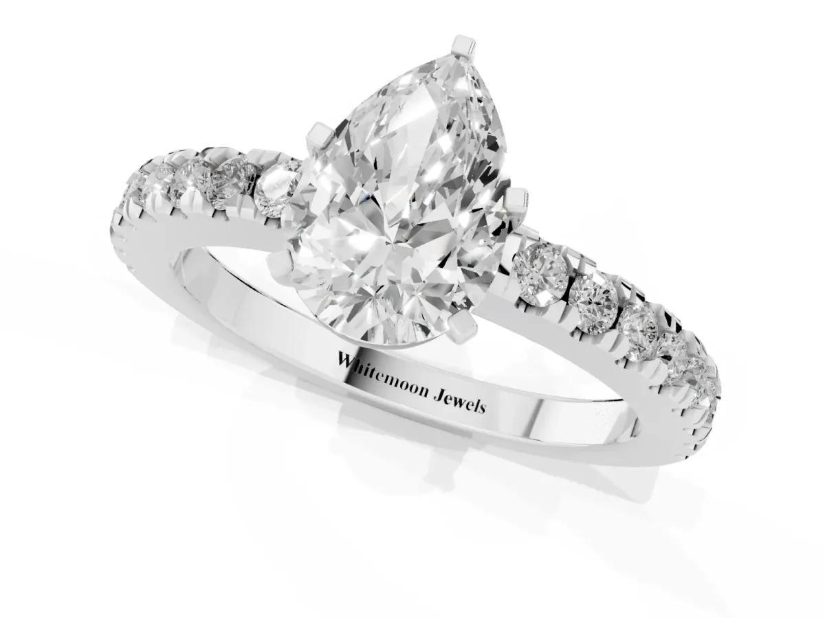 Pear Cut Solitaire Diamond with Pavé Band and Four-Prong Setting Silver