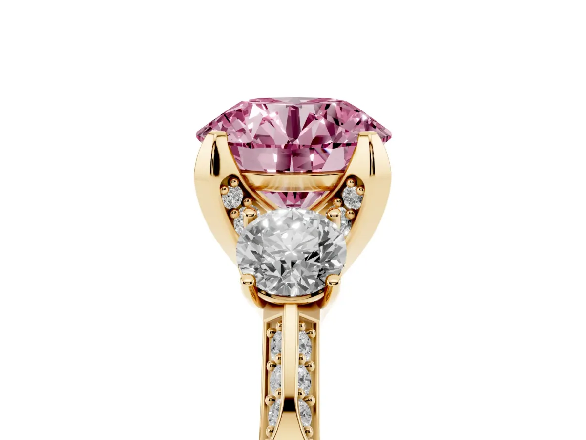 Fancy Pink Round Cut Brilliant Three-Stone Diamond Ring with Pavé Band and Four-Prong Setting Yellow gold