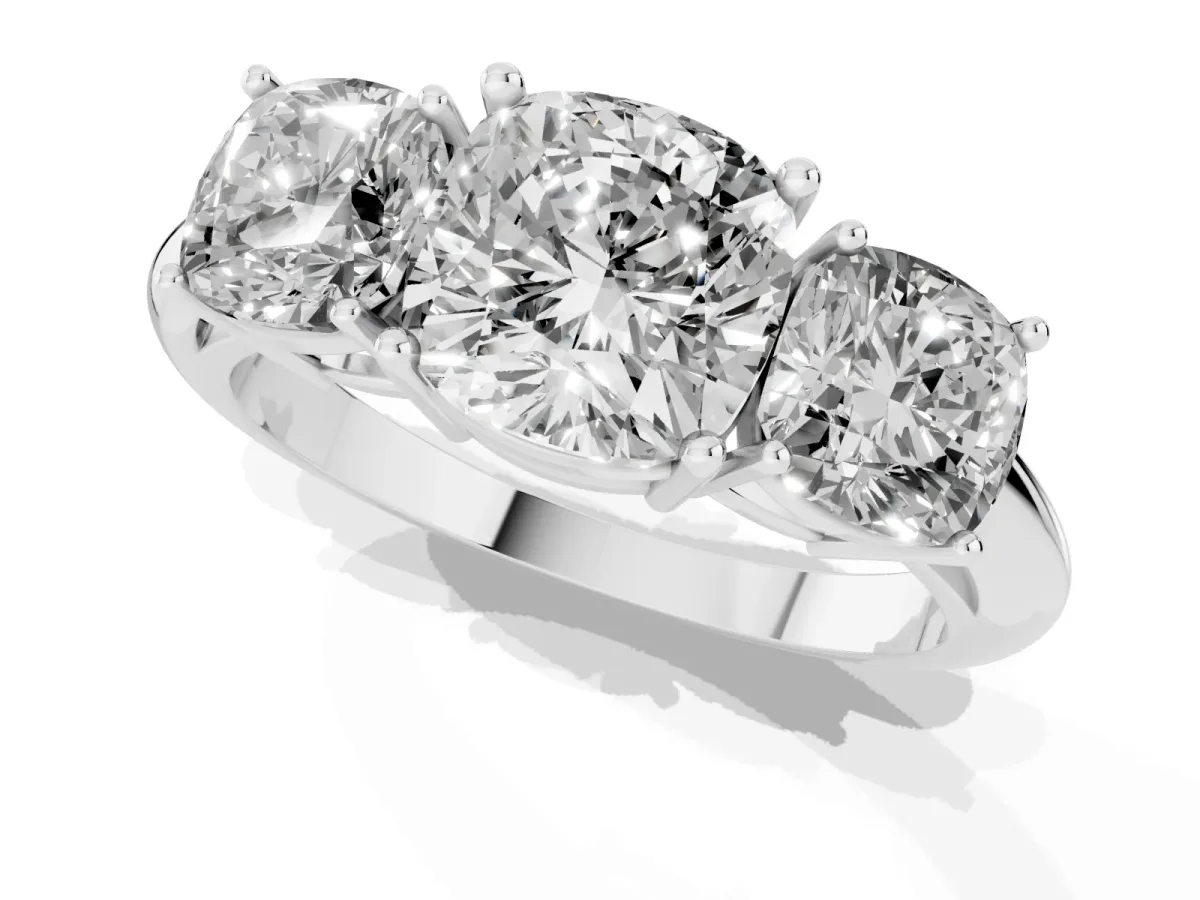 Three-Stone Cushion Cut Cut Diamond Engagement Ring with Prong Setting on a White Gold Band White gold