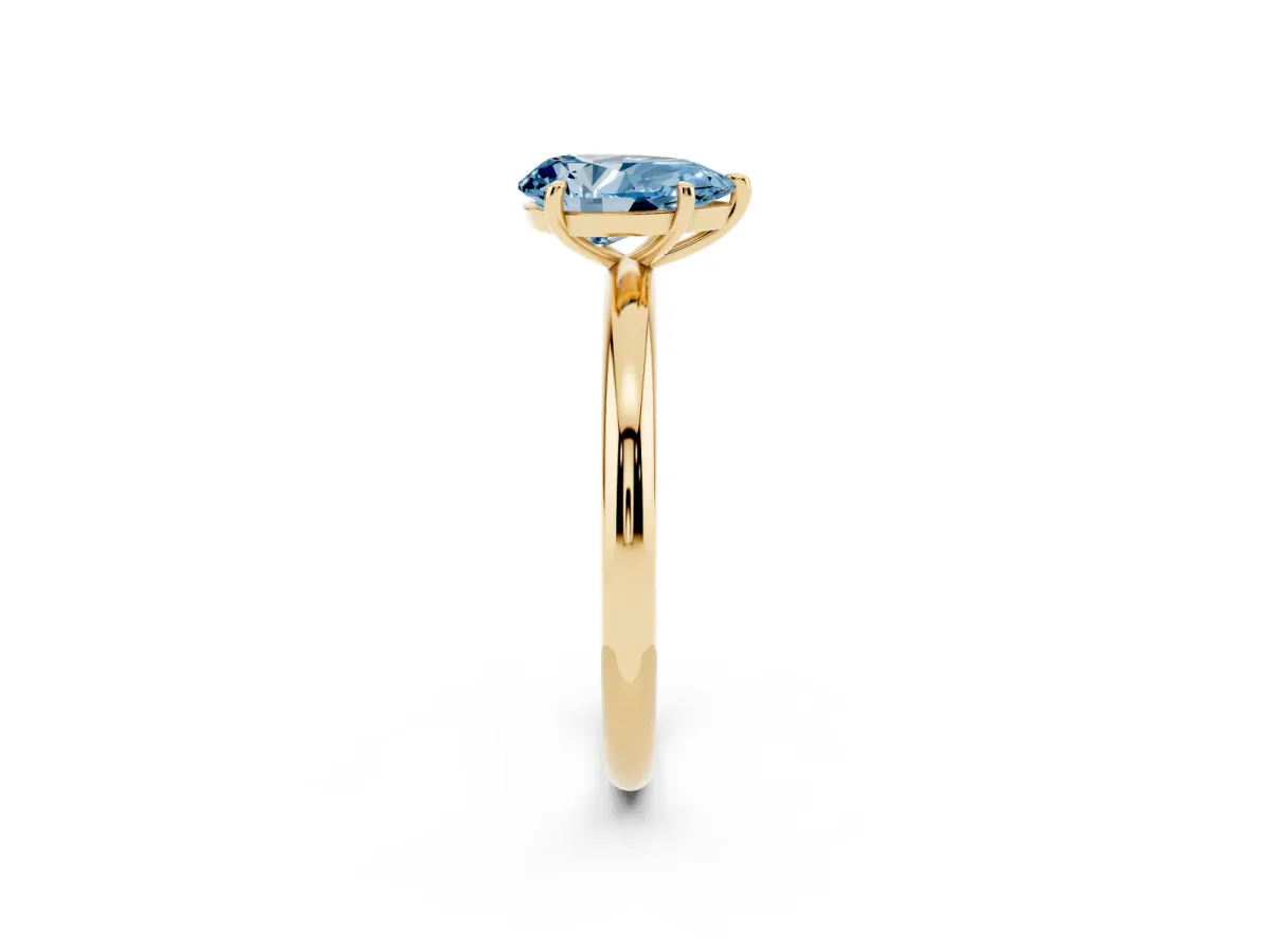 Fancy Blue Pear Cut Solitaire Diamond Ring with Four-Prong Setting on a Plain Band Yellow gold