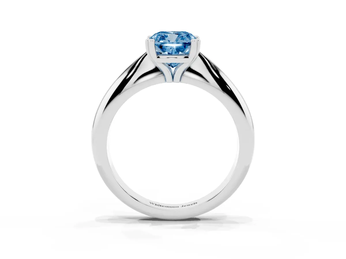 Fancy Blue Cushion Cut Cut Solitaire Engagement Ring with Tapered Band and Four-Prong Setting Platinum