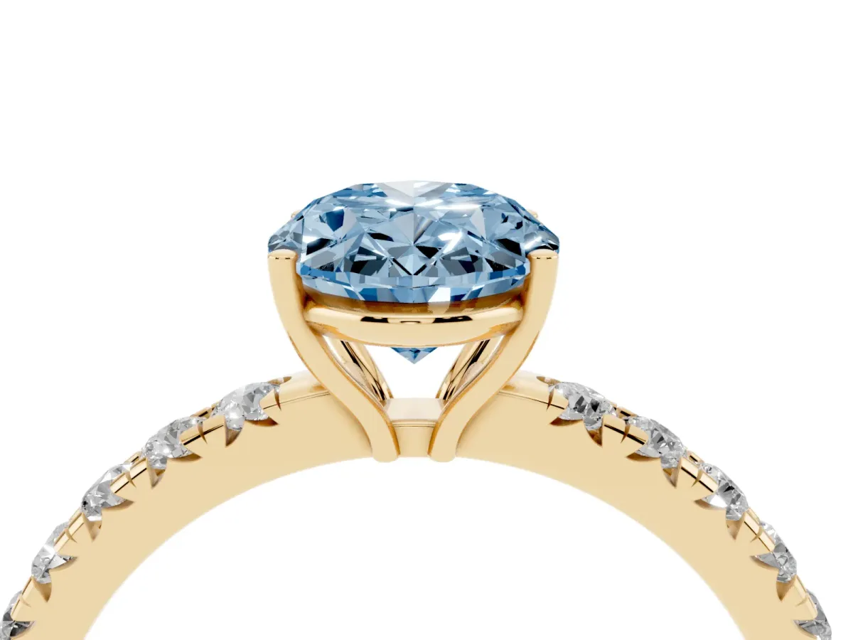 Fancy Blue Oval Cut Diamond Pavé Solitaire Engagement Ring with Four-Prong Setting Yellow gold